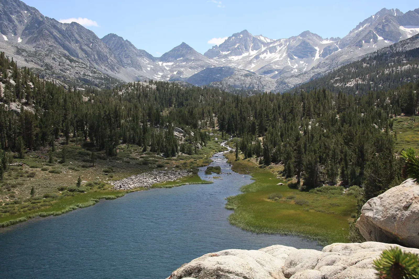 An alpine lake and exposed granite terrain in the John Muir Wilderness