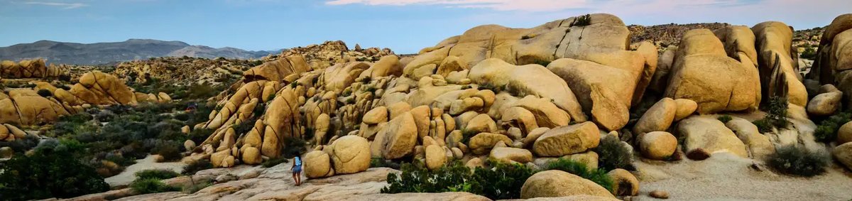 Editorial illustration of a campground among Mojave Desert boulders